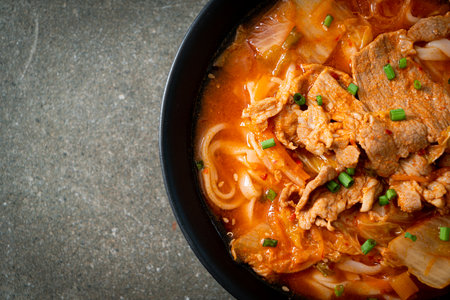 Korean udon ramen noodles with pork in kimchi soup - Asian food styleの写真素材