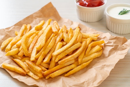 French fries or potato chips with sour cream and ketchup
