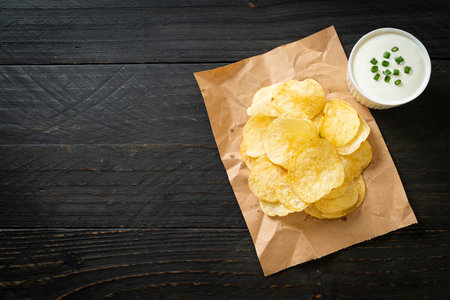 potato chips with sour cream dipping sauceの写真素材