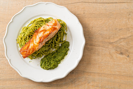 Spaghetti pesto with grilled salmon - Italian food styleの写真素材