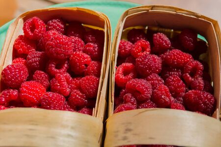 Fresh red raspberry in basket, close upの写真素材