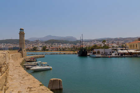 Rethymno, Greece - July  30, 2016: Venetian harbour. The Venetian Harbor of Rethymnon, next to the...