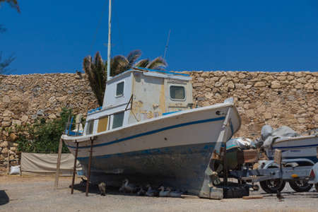 Rethymno, Greece - July  30, 2016: Animals in old Venetian Harbour. The old town of Rethymnon is one...