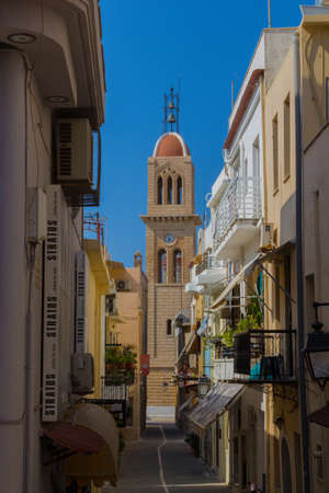 Rethymno, Greece - August  4, 2016: Narrow venetian street with view to Metropolitan Church. The old town of Rethymnon is one of the best-preserved towns of the Renaissance.のeditorial素材