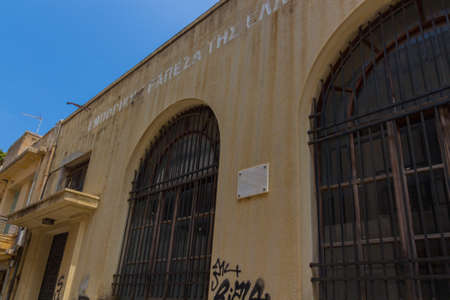 Rethymno, Greece - August  5, 2016: Abandoned building of the National bank. The Greek...