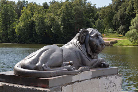 Egyptian sphinx stylized cast-iron sculpture of a lion against a background of a pond, Kuzminsky...