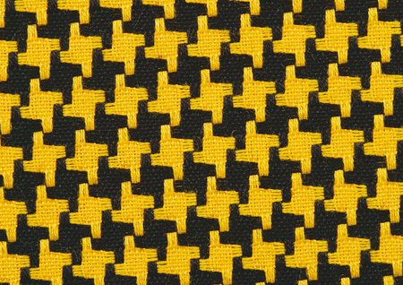 Close-up of a yellow and black pattern on fabric