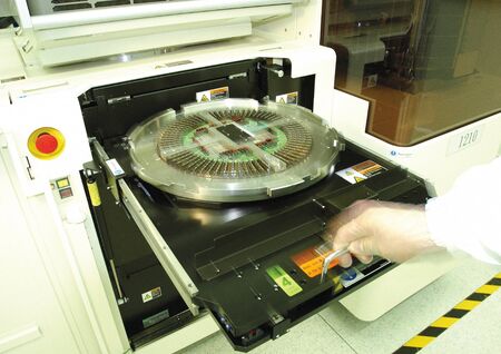 Scientist's hand operating equipment in a laboratory