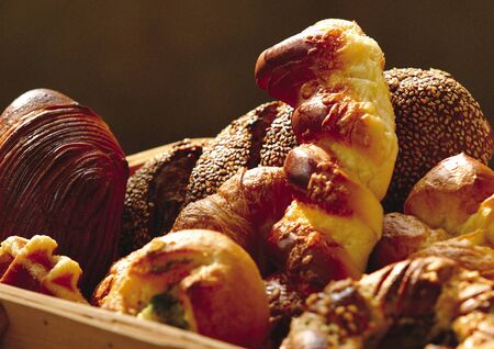 Close-up of assorted breads in a picnic basket