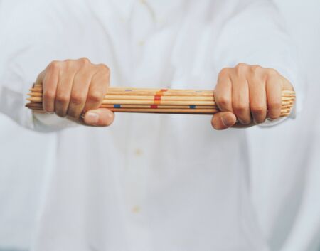 Close-up of pencils in a man's handsの写真素材