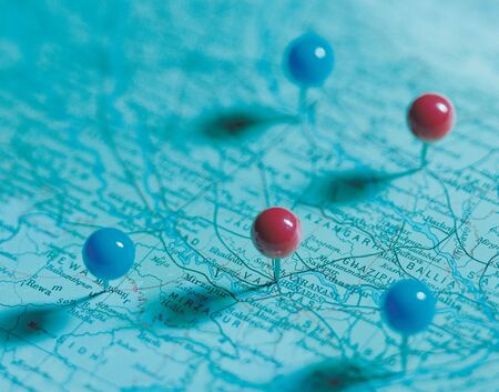 High angle view of pins on a mapの写真素材