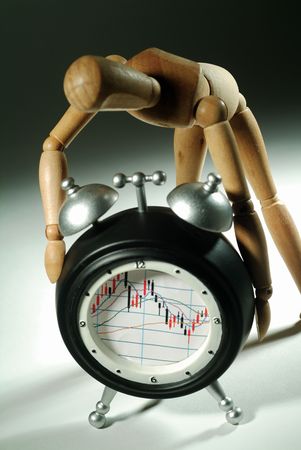 Close-up of a wooden dummy on a clock