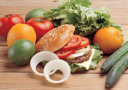 High angle view of assorted vegetables and a hamburgerの写真素材