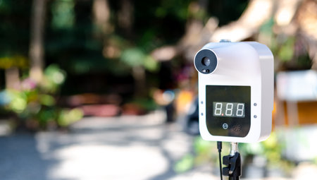How to prevent the COVID-19 virus,
Automatic infrared thermometer at the attraction Used to check the body temperature of tourists. Use this device to check your body temperature faster than normal.の写真素材