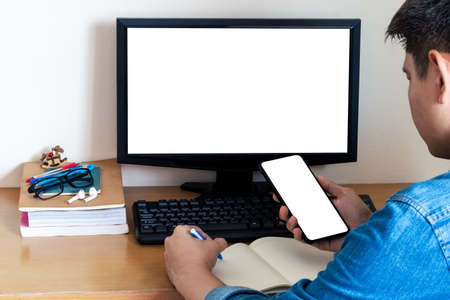 Mockup Copy Space Computer Notebook Laptop Concept , a man's hand using a laptop on internet websites at the office, keyboards on laptop computer with balnk copy screen for your advertising content.の写真素材