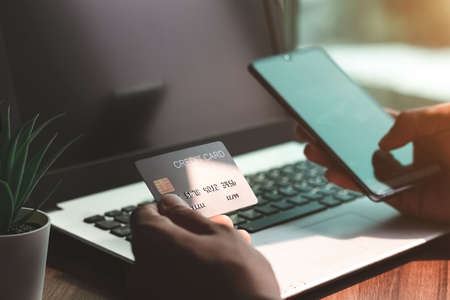 Using smartphone for online shopping. Credit card internet pay.の写真素材
