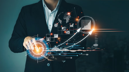 Concept of startup business to be successful, Businessman touch tablet screens, business icons and network connections on global modern interface.の写真素材