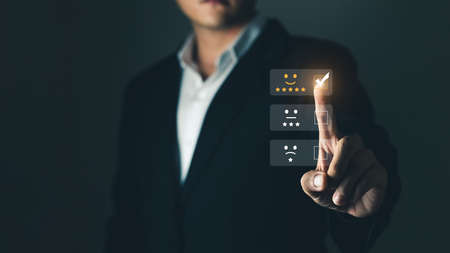 User give rating to service experience on online application, Customer review satisfaction feedback survey concept, Customer can evaluate quality of service leading to reputation ranking of business.の写真素材