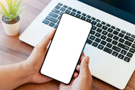 mockup copy space phone, man's hand holding smartphone with blank white copy screen for your...