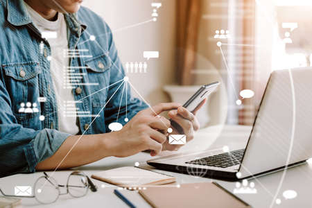 young man's hand with a laptop. A man who works remotely at home, ideas about the network or...