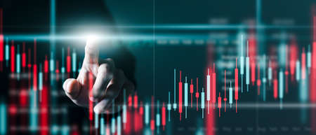 Businessman Trader at work technical price chart and red and green candlestick chart indicator and...