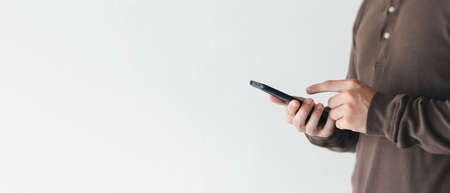 business man holding smart phone. horizontal image size.