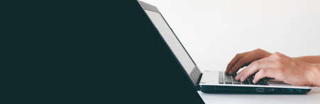 A person's hand is pressing a computer keyboard to make it easier to work. Put your screen in advertising.image size horizontal.の写真素材