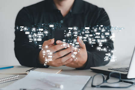 Business ideas, businessmen with smartphones, interface technology, global connectivity.の写真素材