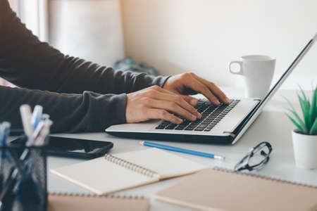 Work using mobile phone typing computer mobile chat laptop contact us at workplaces, planning ideas...