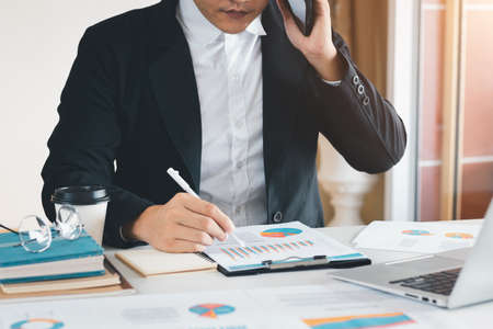 Work using mobile phone typing computer mobile chat laptop contact us at workplaces, planning ideas...