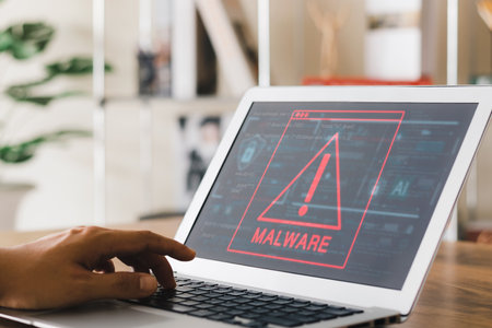 Concept of cyber crime and protection way, laptop showing malware and virus screen, hacking passwords and personal data.の写真素材