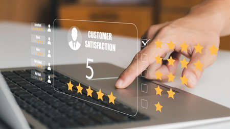 User give rating to service experience on online application, Customer review satisfaction feedback survey concept, Customer can evaluate quality of service leading to reputation ranking of business.の写真素材
