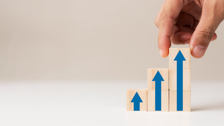 Business success idea, corporate growth process, wooden block arrangement by hand step by step with...