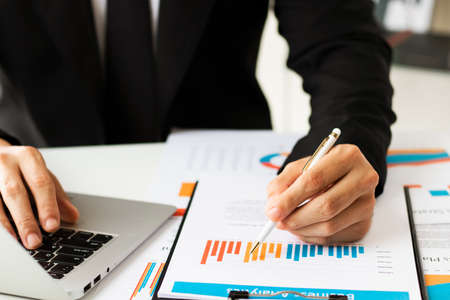 businessman executive analyzing and planning business performance from financial data, analyzing finance data and economic growth graph chart.の写真素材