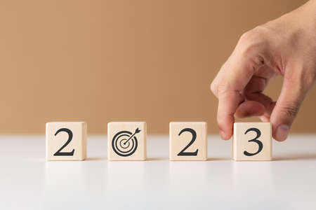 2023 new year goal planning idea, wood block cube with new year 2023 and target icon, business vision.の写真素材