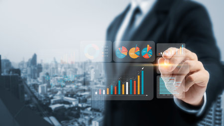 The concept of business growth and financial investments, developing a successful company or industry, showing a graph of business growth on a virtual screen.の写真素材