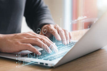 Businessman touching virtual screen Graph analysis of business growth and investment, strategic planning to increase sales profits, long-term business plan.の写真素材