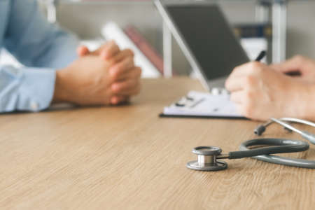 The doctor talks to patient, recommends treatment analyzes medical reports A thorough physical...