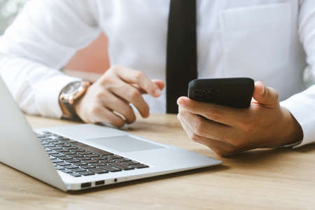 Work using mobile phone typing computer mobile chat laptop contact us at workplaces, planning ideas...