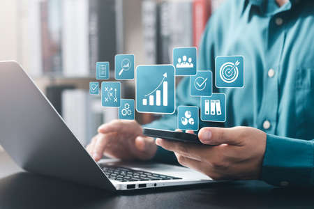 concept of long-term business development and management Executives looking at virtual screens...
