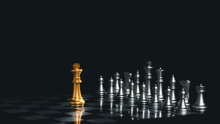 Close-up King standing on a chessboard. There's a falling chess in front, leadership. teamwork...