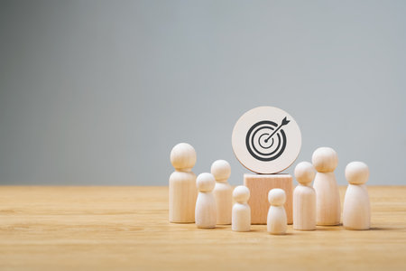 Goal setting concept for success, wooden doll. Dart board and arrows for goals, goals and future business success.の写真素材