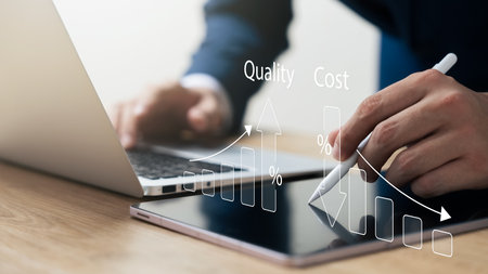Businessman using laptop and tablet to analyze company growth Business growth arrow graph and future cost reduction. development to achieve goals Financial information for long-term investments.の写真素材