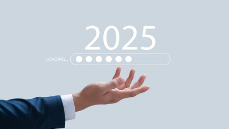 Businessman shows download bar counting down to 2025, New Year's Eve welcoming the new year from...