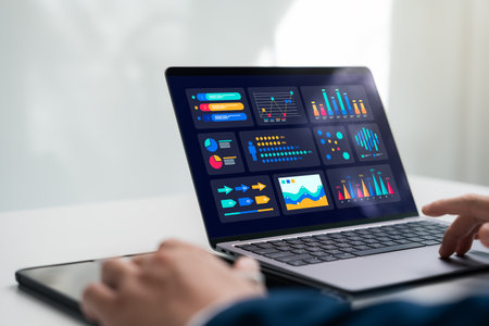 Businessman using laptop with charts on dashboard analyzing business data, marketing, sales,...
