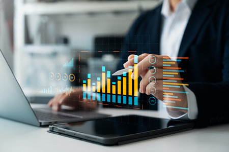 Business data analysis report with performance indicators dashboard, businessman using digital tablet and laptop to analyze data, economic growth chart graph, market research and strategic planning.の写真素材