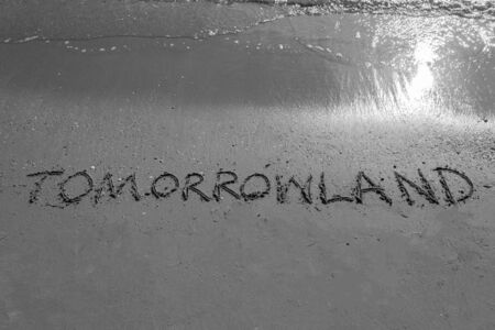 Tomorrowland sign on a beach in black and white colourの写真素材