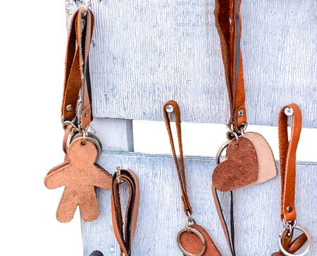 Leather Keychain on wooden backgroundの写真素材