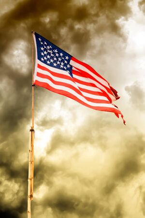 American flag waving on bamboo poles in vintage toneの写真素材