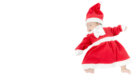 Portrait of adorable baby girl with santa costume. Isolated on white background with copy spaceの写真素材